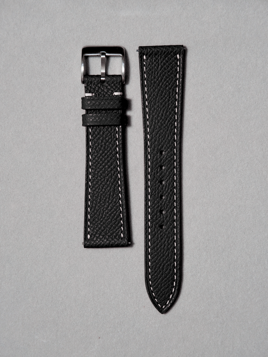 Handcrafted epsom leather watch strap in black with white stitching. Comes with quick release spring bar. available in 17-20 mm lug widths.