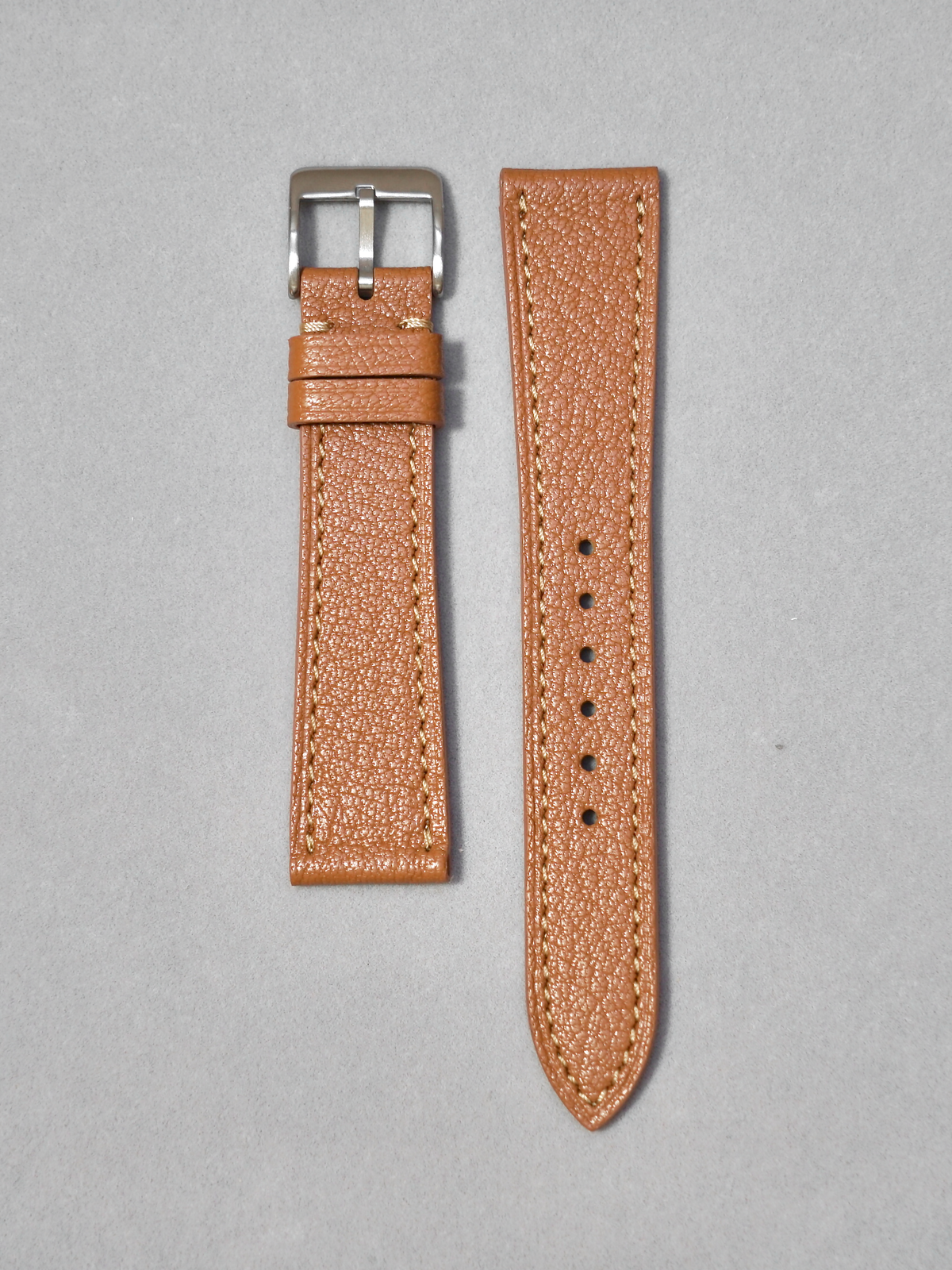 Handcrafted Brown Alran leather watch strap in 17-20mm lug widths. Leather sourced from France Alran S.A.S. Brushed buckle in silver or gold. Quick-release spring bar for easy installation.