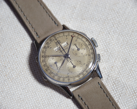 Close up of Vintage Wittnauer Triple Date Calendar Chronograph with Valjoux 72c with grey nubuck straps
