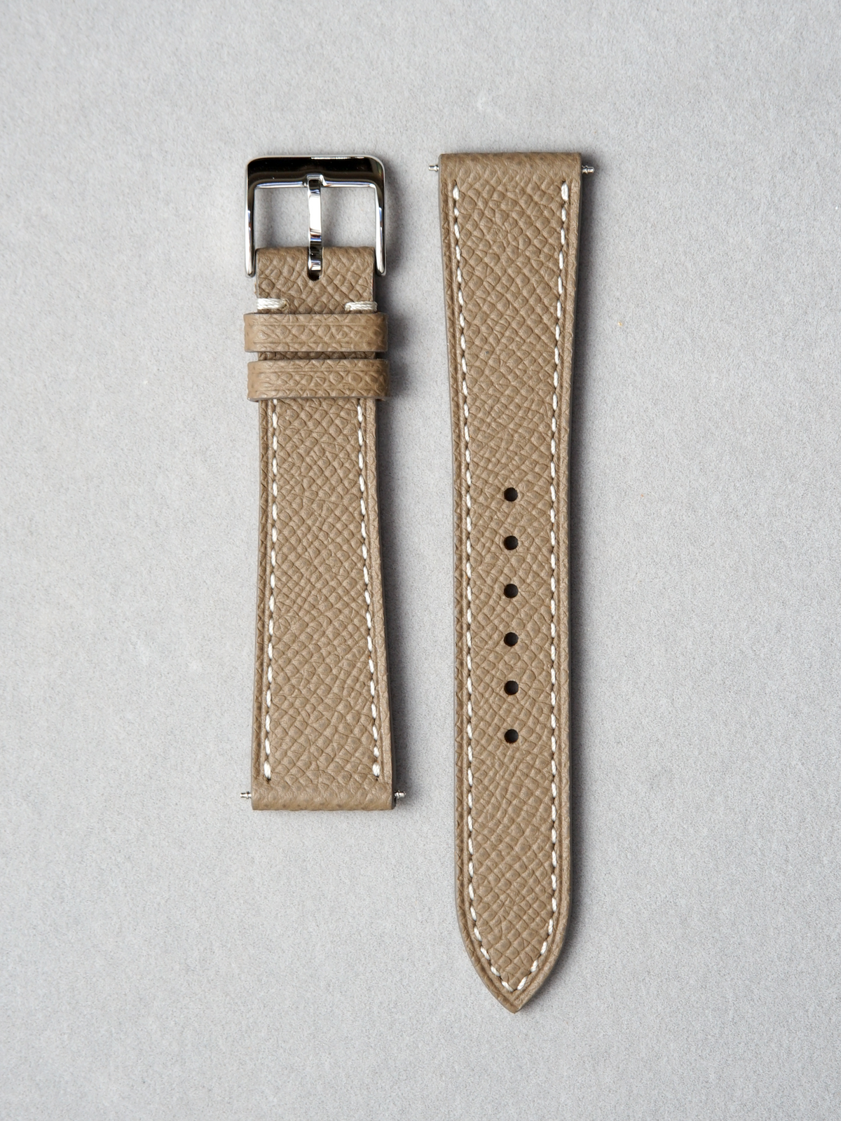 Handcrafted Epsom leather watch strap in taupe. pairs with quick release spring bar. available in 17-20 mm lug widths.