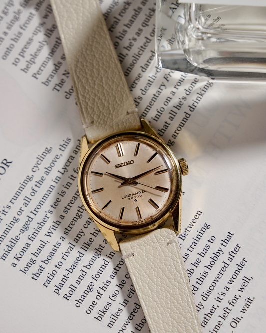 gold vintage seiko lord marvel with two-stitch alran leather strap in cream white