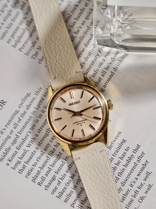 gold vintage seiko lord marvel with two-stitch alran leather strap in cream white