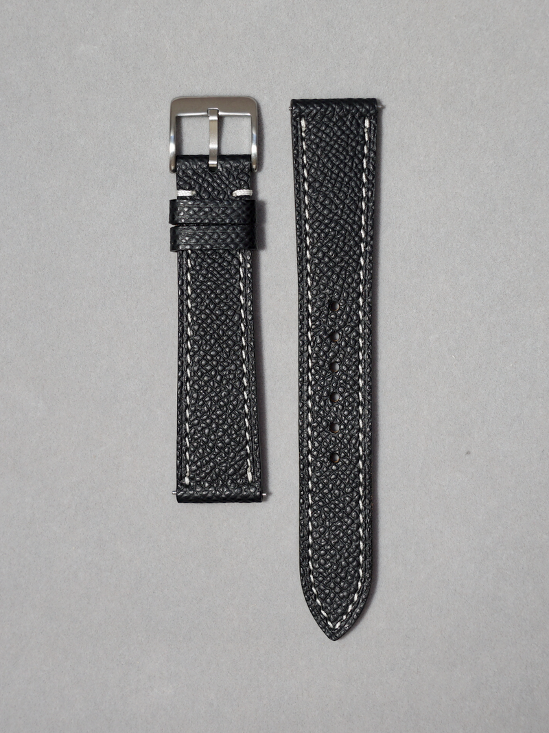 Handcrafted epsom leather watch strap in black with white stitching. Comes with quick release spring bar. available in 17-20 mm lug widths. 