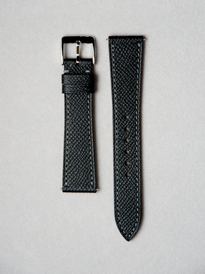 Handcrafted epsom leather watch strap in black with white stitching. Comes with quick release spring bar. available in 17-20 mm lug widths. 