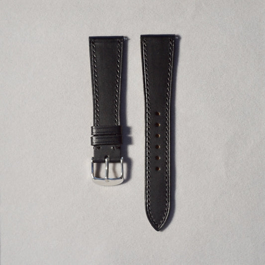 Handcrafted Black Shell Cordovan leather watch strap in 17-19mm widths. Genuine leather, small-batch production. Brushed buckle in silver or gold. Quick-release spring bar for easy installation.