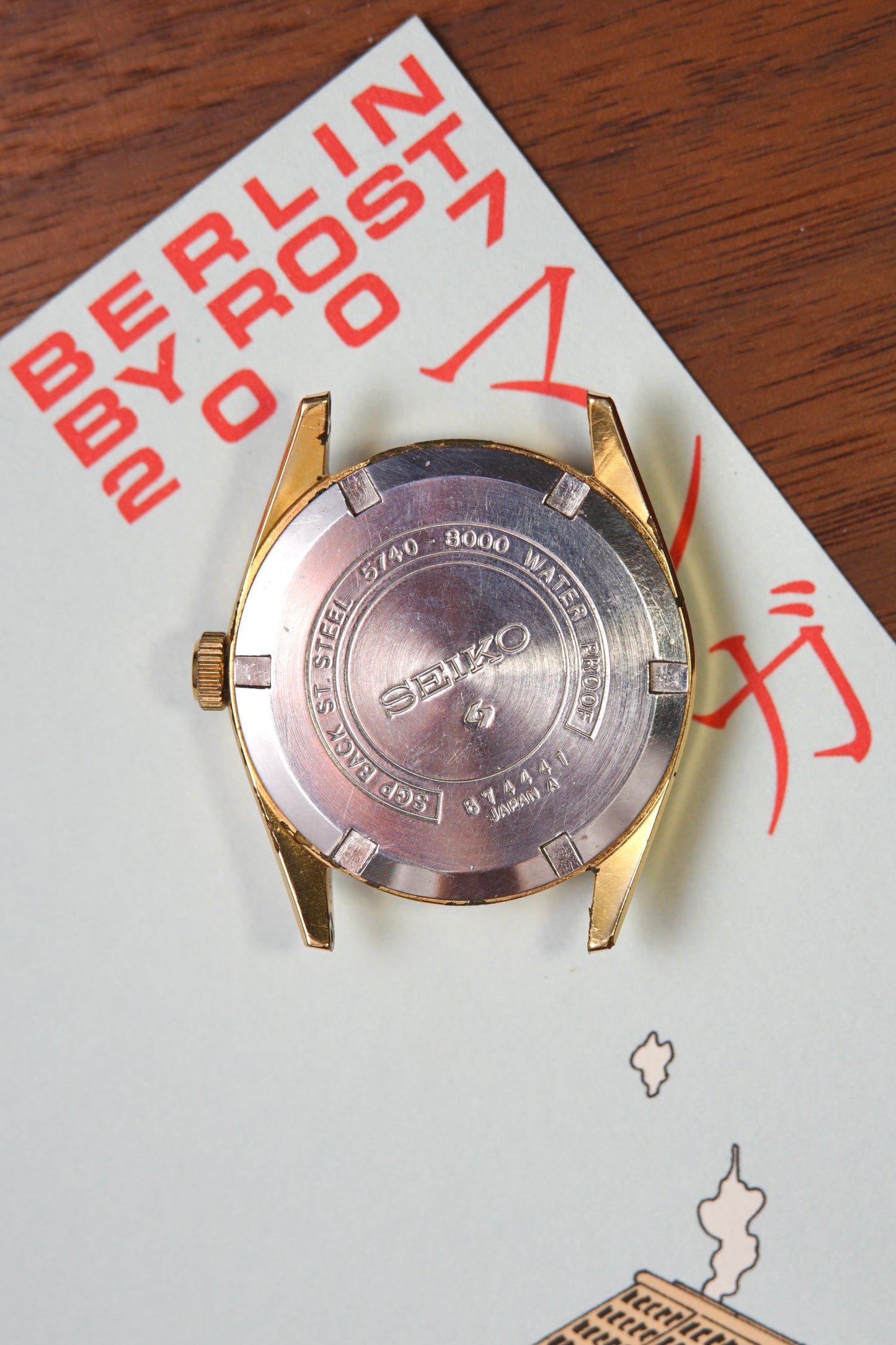 Seiko watch case on a piece of paper with text and graphics
