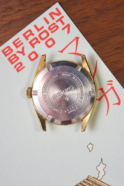Seiko watch case on a piece of paper with text and graphics